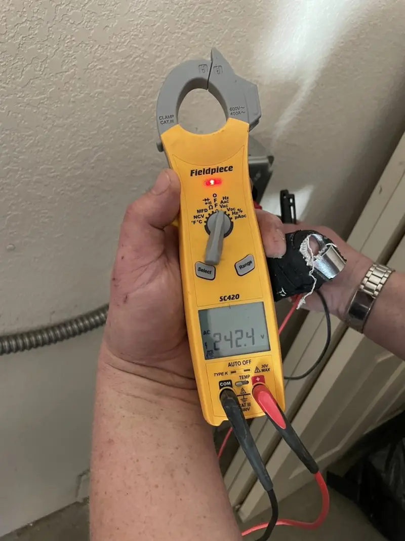 Voltage testing with clamp meter during Generator Installation in Greenville